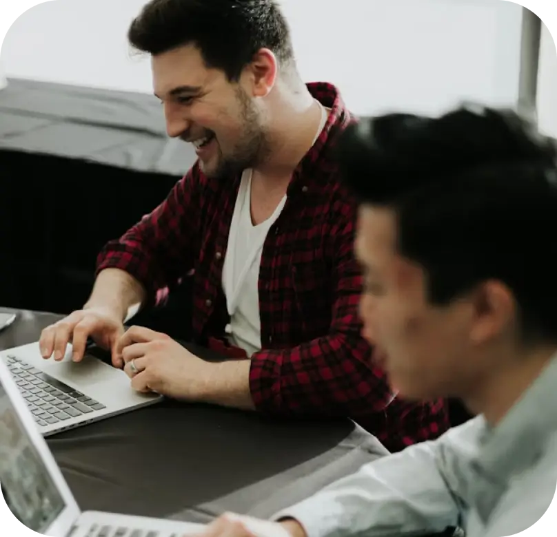 A user happy from claiming titans developer credits with his coworker. Photo by Priscilla Du Preez